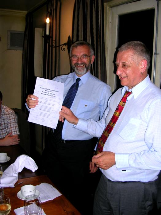 Presentation of a signed menu to Dr Phil Potts